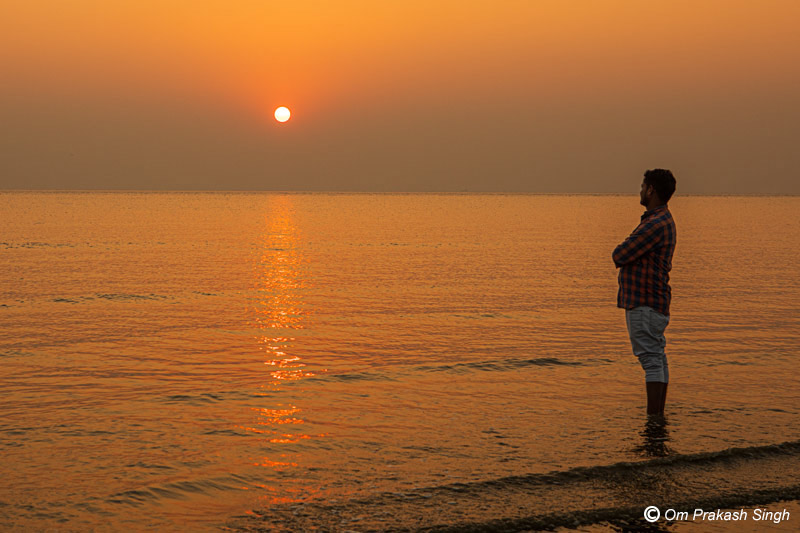 Relaxing at a beautiful sunset over the horizon helps improve mental health at Sagar Island in South 24 Parganas district, West Bengal